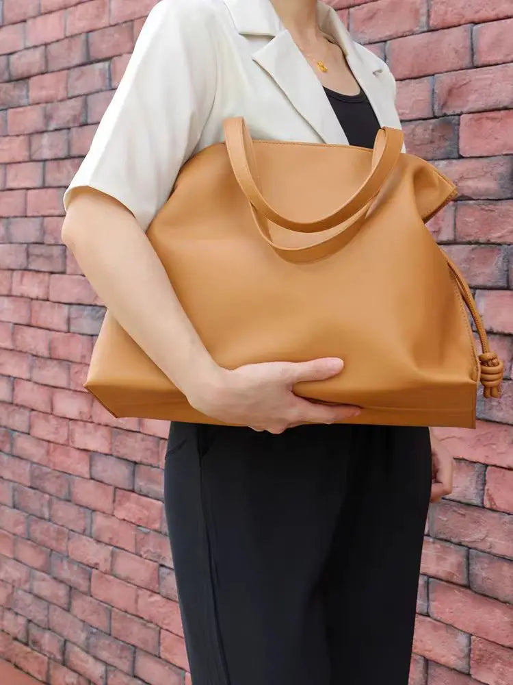 Beige Leather Drawstring Pouch Bag 2026